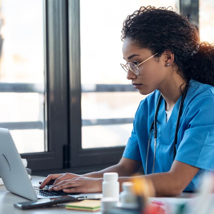 Nurse trying to assist patient in navigating step therapy and benefit designs.