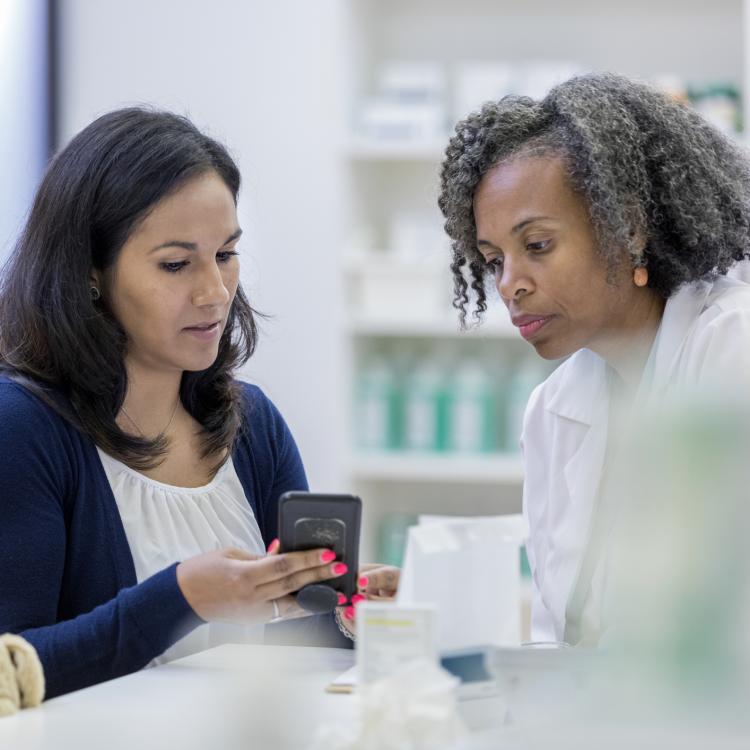 Patient discussing options with her pharmacist