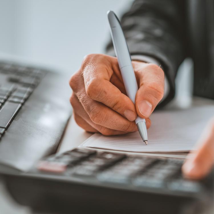 Man working with calculator